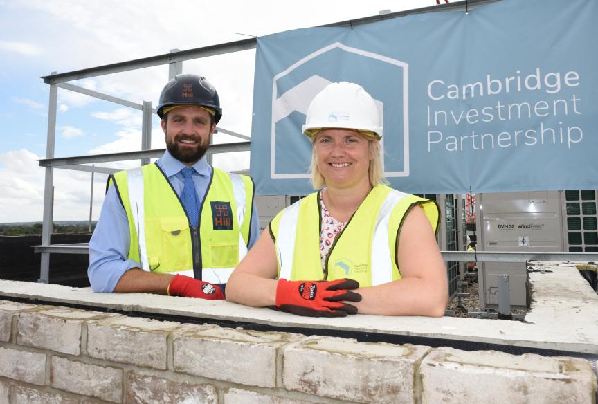 Man and woman at topping out ceremony 