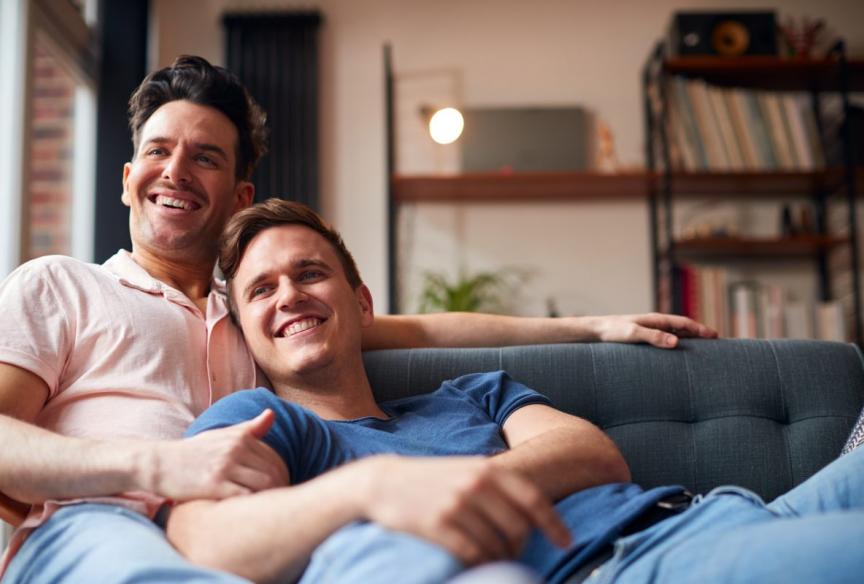 Two men sitting on a sofa